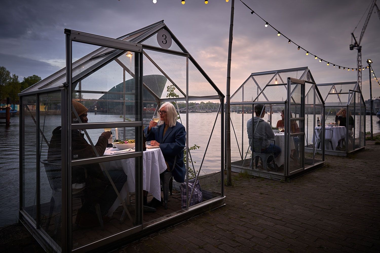 This Amsterdam restaurant built glass booths to help diners socially distance